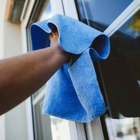 Window cleaner using a window cleaning Microfibre cloth